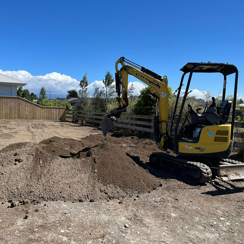 New Lawn Construction, image of a digger doing preparation of ground for seeding